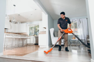 water damage restoration specialist drying floor in home